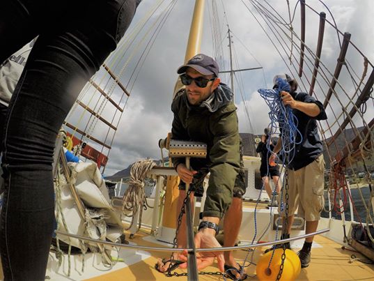 Scientist deploying a BRUV underwater camera